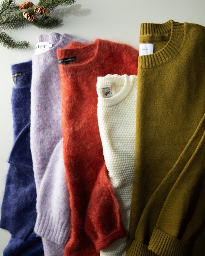 A set of 5 sweaters in blue, purple, orange, white, and green.