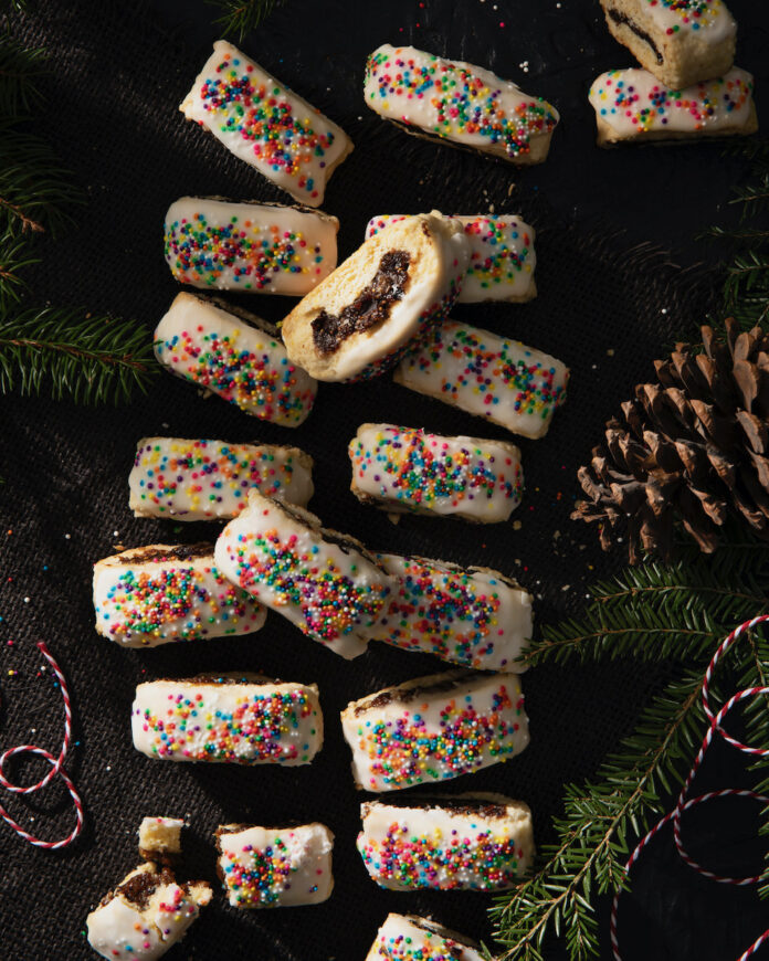 Cuccidati Cuccidati, Sicilian fig cookies, on a brown background