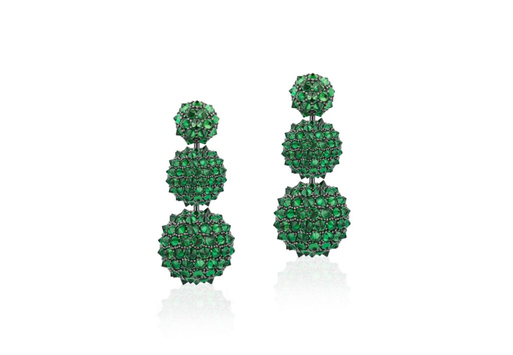 Emerald drop earrings with three sets of balls.
