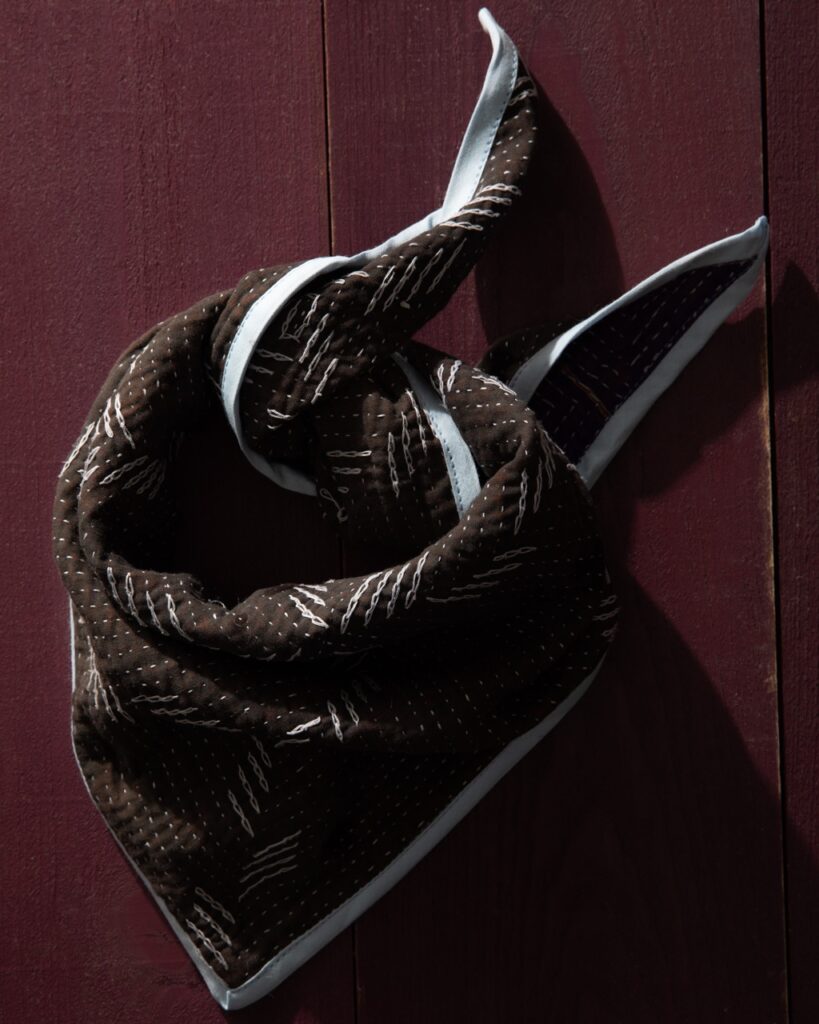 A scarf handkerchief tied up on a table.