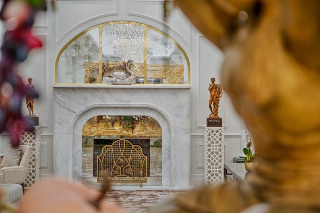 Armina Stone white fireplace shot through holiday decor. 