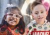Giving Guide 2024: Western Pennsylvania School for the Deaf Two children, a girl in a Moana shirt and a boy in a Marvel shirt, sit side by side with smiles.