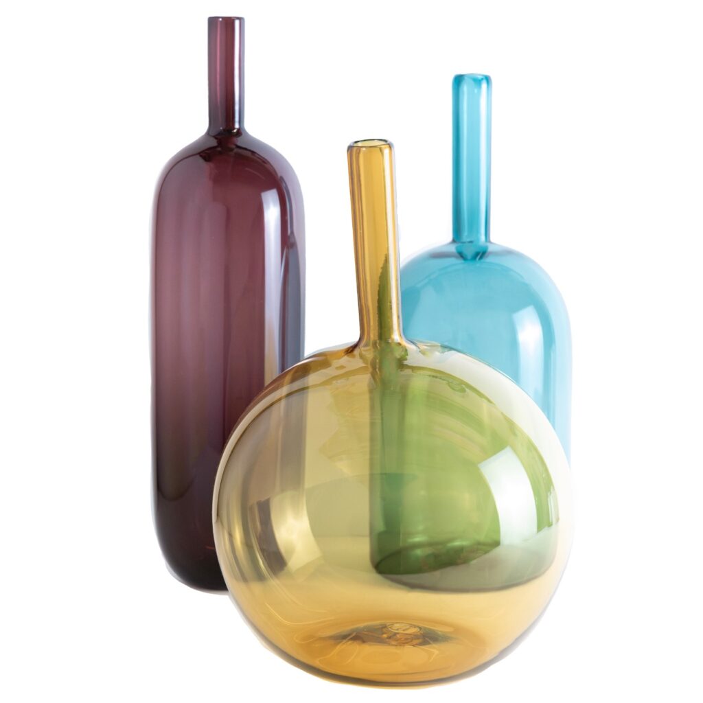 Three vases in purple, yellow, and blue.