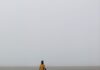 Eugene Macki Brings a Sense of Place to the Mattress Factory In a land-based work by Eugene Macki, a man stands in a foggy, grey desert plain