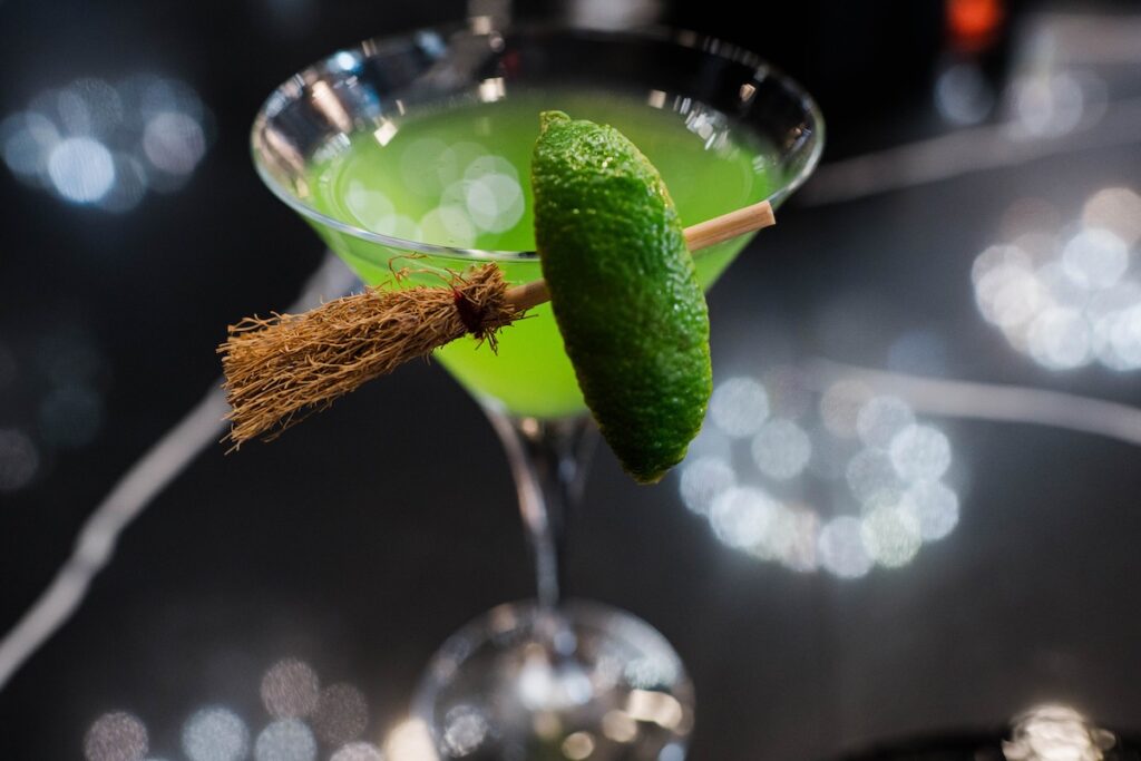 A green cocktail in a martini glass, meant to look like Elphaba from Wicked