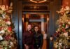 How to Throw a Large Party Justin Matase and Dr. Elie Aoun pose in front of their festively decorated home.