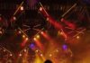 5 Pittsburgh Events This Week (December 16-22) A person playing guitar on a stage with big lights and sparks from the ceiling.