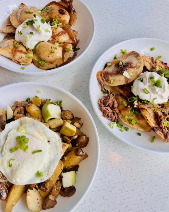 Three plates of potato hash from Square Cafe's winter menu update on a white background