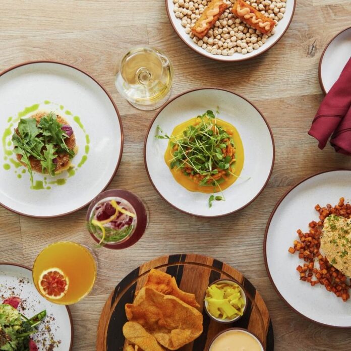 A set of plates on a table at EYV, a hotbed for clean eating