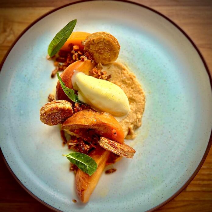 5 Pittsburgh Events This Week (January 27-February 2) A plate of food from EYV restaurant in Pittsburgh with carrots, greens, and other veggies on a white plate.