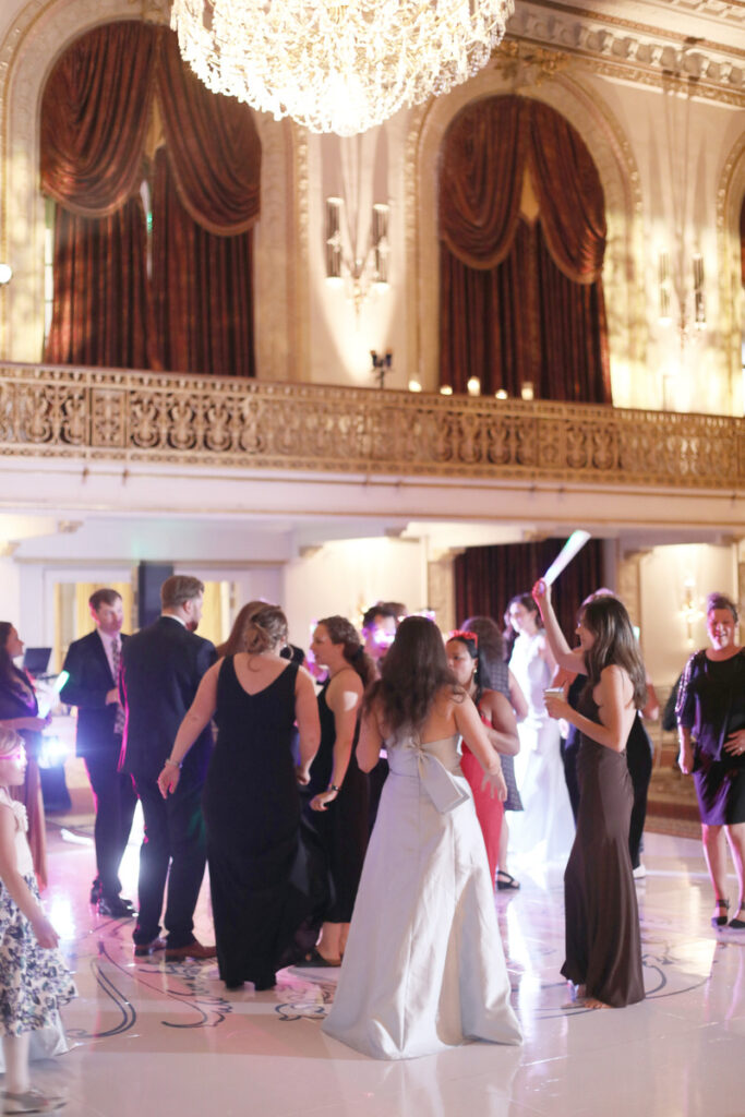 The lively and joyful atmosphere of the wedding reception.