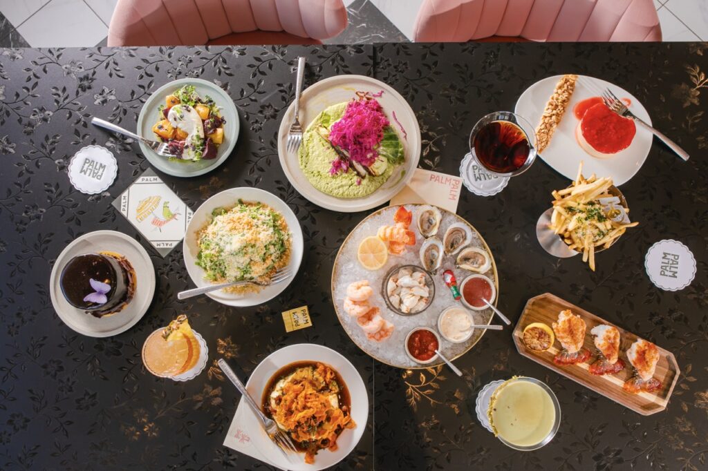 Various round plates sit on a black tabletop.