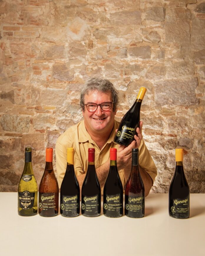 Derek Mossman Garage Wine Co Winemaker Derek Mossman with bottles of his wine.