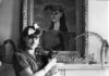 Gertrude Abercrombie’s Bohemian Dreams Painter Gertrude Abercrombie besides "Self Portrait with My Sister," holding her black cat.