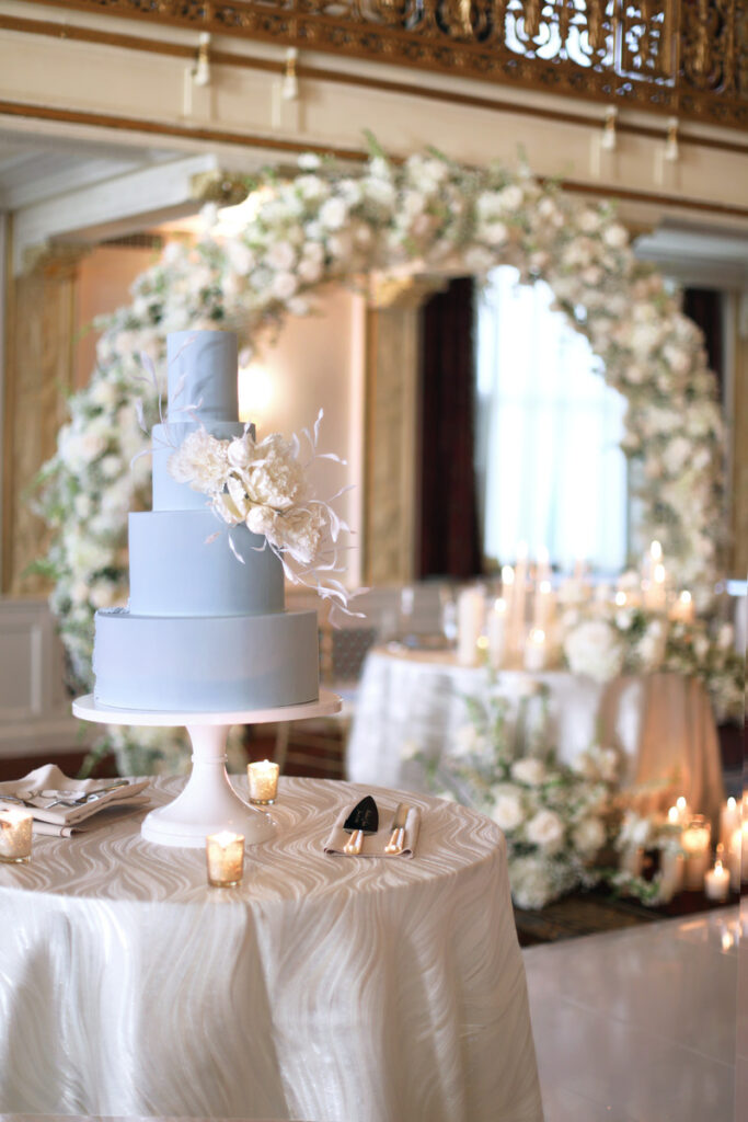 A beautifully decorated wedding cake and reception area.