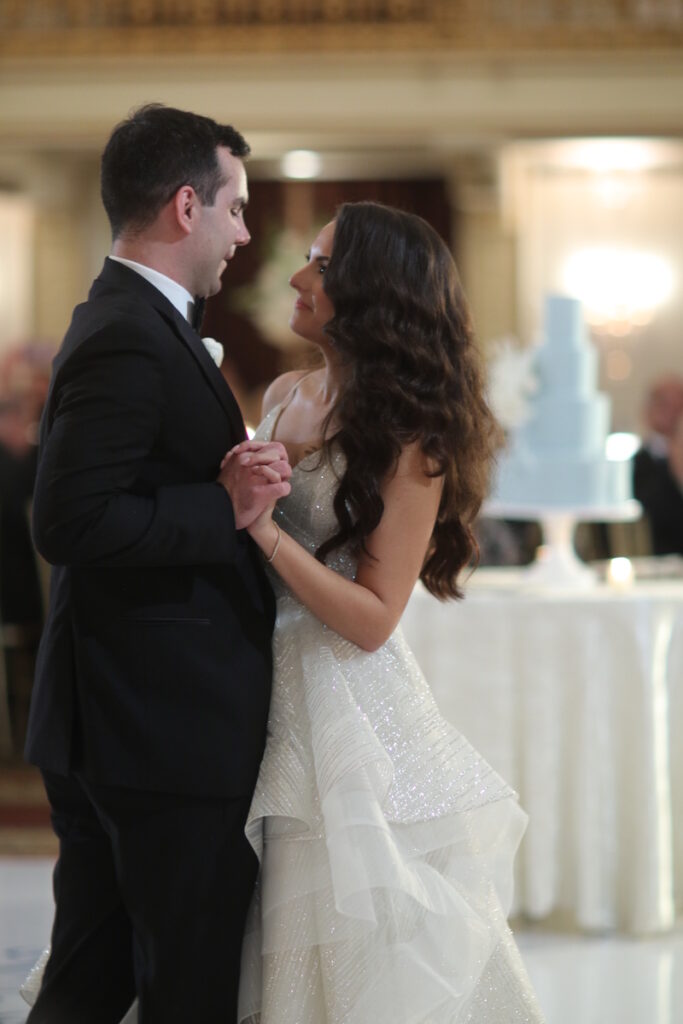 The bride and groom sharing an intimate moment as they dance together at their wedding reception.