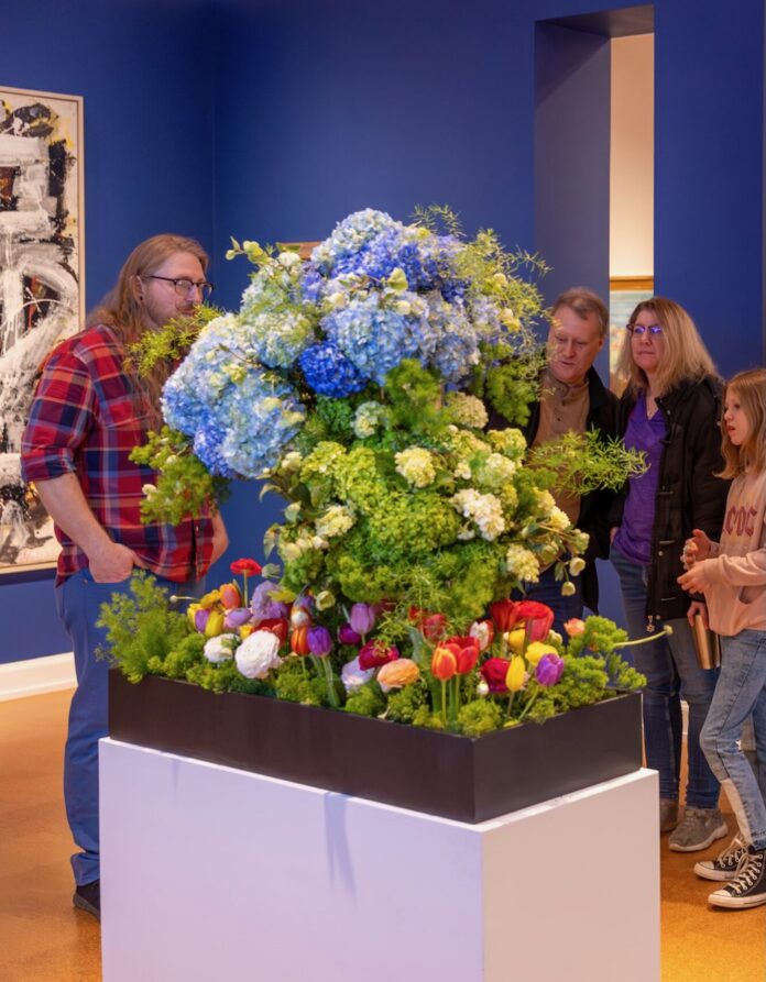 A flower display in the middle of an art museum in Pittsburgh for a special event.