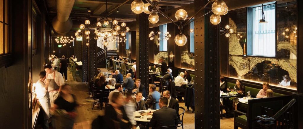 The dimly lit interior of The Commoner, a hotel bar and restaurant in downtown Pittsburgh.