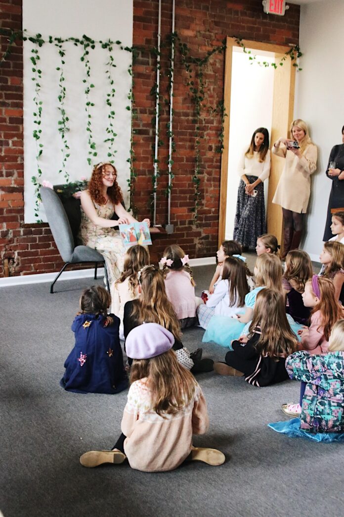 5 Pittsburgh Happenings This Week (March 17-23) A woman in a princess costume reads to a group of young children at Press House Coffee in Pittsburgh.