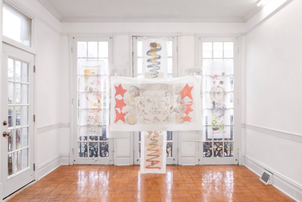 A white set of French doors in Margaret Kross's gallery Romance, which screens over them by Emilia Wang