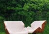For Santom Upholstery, Furniture is More Than Things Two chairs by Santom Upholstery on a green background.