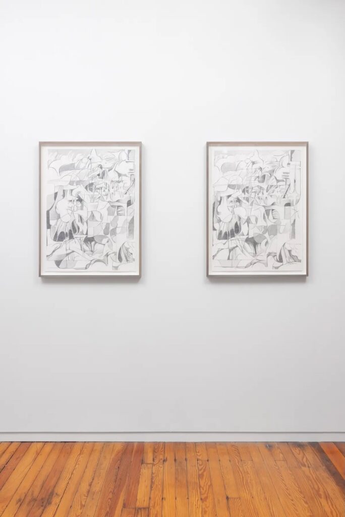 Two works by Paul Peng on a white wall. 