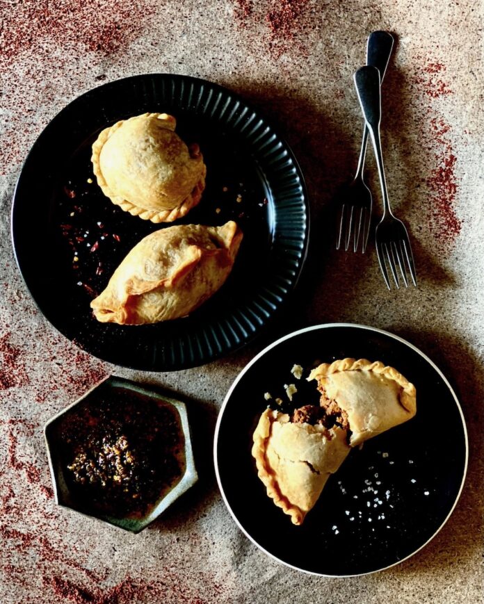 Two plates of empanadas from Pittsburgh restaurant Mi Empanada.