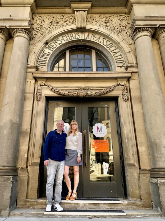 Rob Hirst and Danielle Cain stand in front of their new restaurant, Hey Babe.