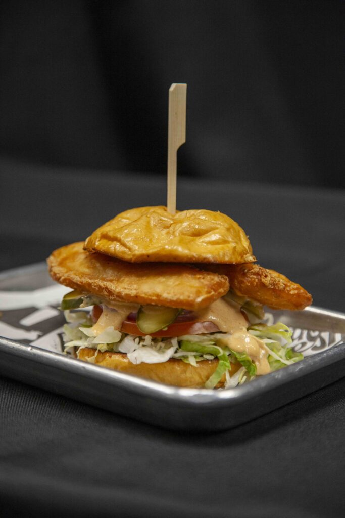 A fish sandwich on a metal tray for Lent at Rivers Casino Pittsburgh.