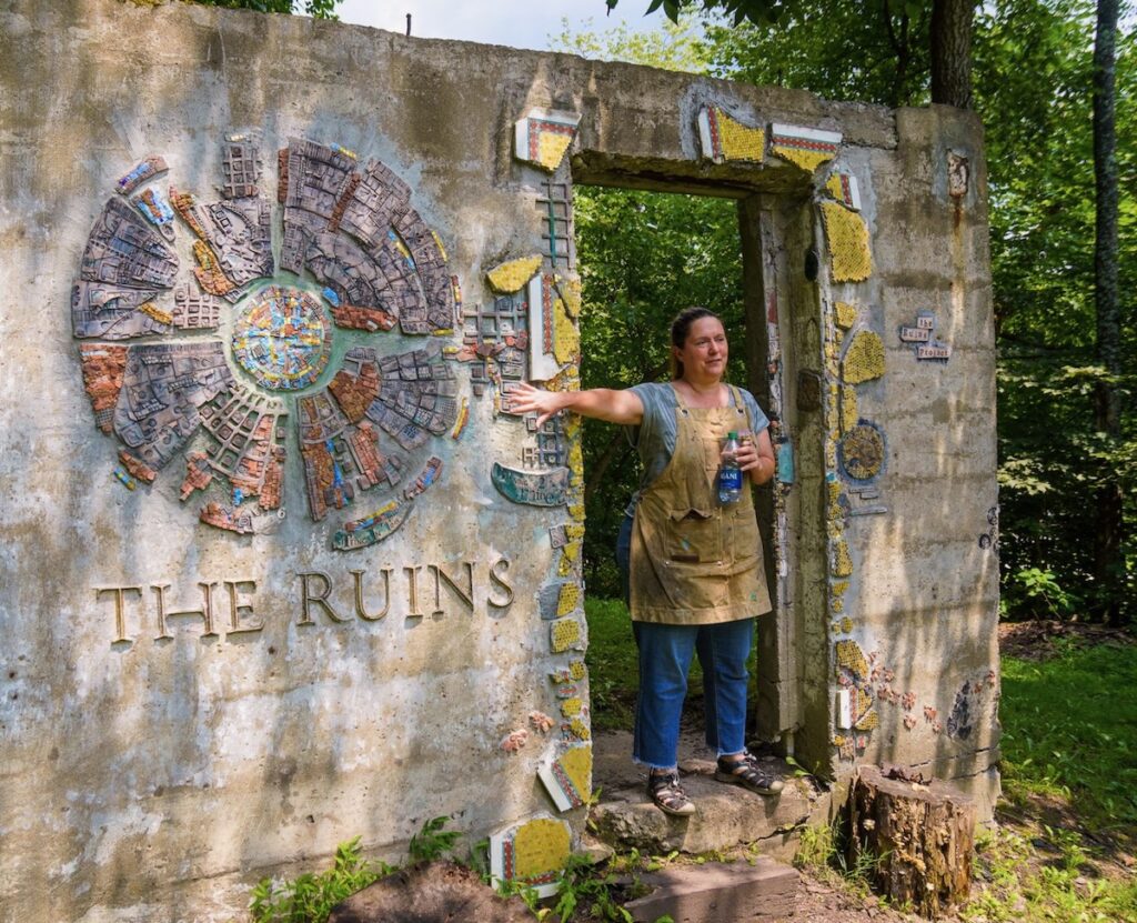 A woman stands in the doorway of The Ruins Project just outside Pittsburgh.