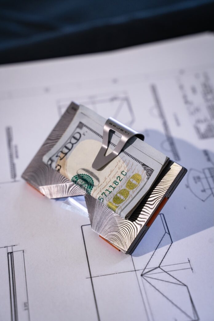 A $100 bill in a wallet clip from Bejeti, a luxury wallet