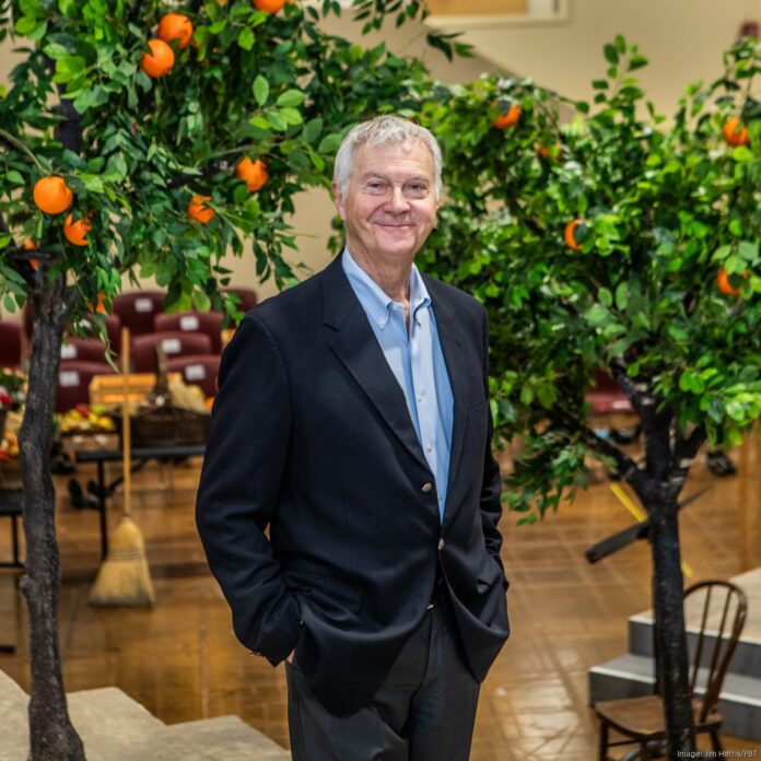 Christopher Hahn, General Director of the Pittsburgh Opera, stands in a garden.