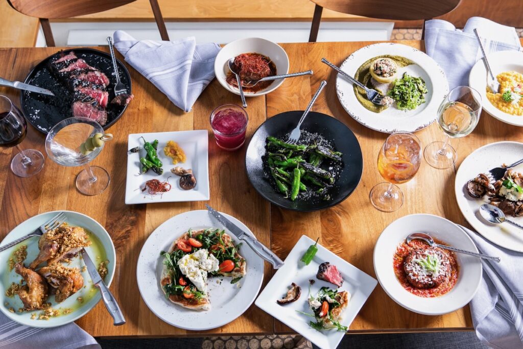 A set of white plates at New American restaurant VIvo Kitchen
