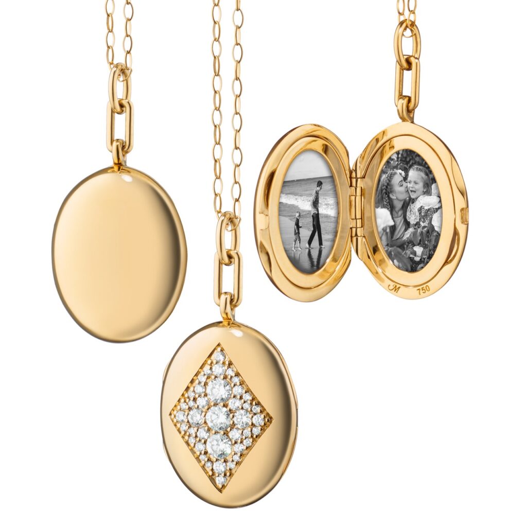 Three warm gold picture lockets from Henne Jewelers in Pittsburgh lay on a white background.