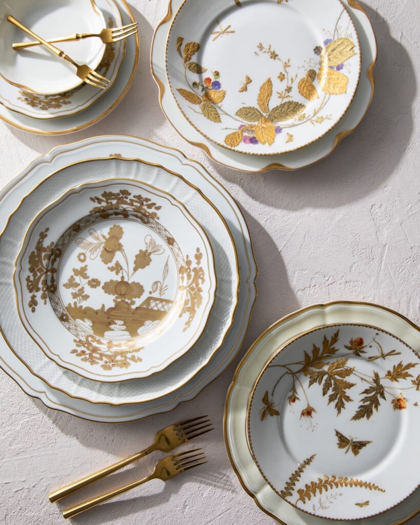 A serious of Warm gold and white plates designed by Melissa Ewen in Pittsburgh.