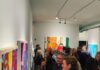 So, You Want to Start Buying Art A crowd of people in Jeffrey Jarzynka's gallery looking to start buying art.