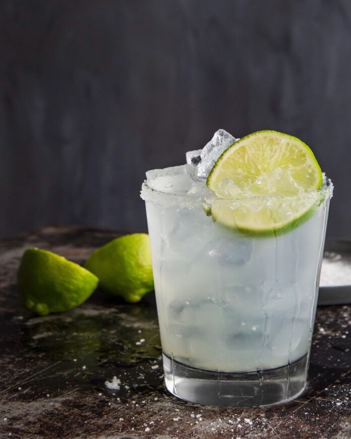Classic Margarita A classic margarita recipe by Maggie Weaver, garnished with lime.