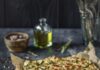 Scarpaccia (Italian Zucchini Tart) A piece of parchment paper sits on a counter top with square slices of Italian Scarpaccia scattered on the paper.