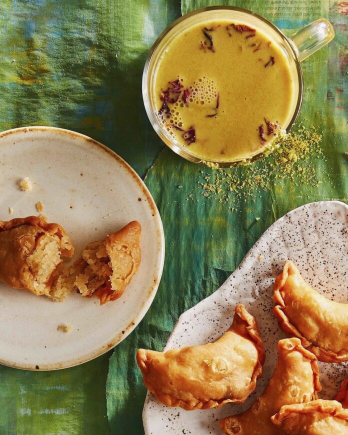 Sip a Cup of Thandai Thandai staged with gujiyas, a sweet Indian treat for Holi