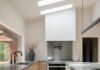 Explore Tolga Sevdik of Richard DeShantz Restaurant Group’s Kitchen Tolga Sevdik from Richard DeShantz Restaurant Group's modern kitchen with wood cabinets, dark countertops, and skylights.