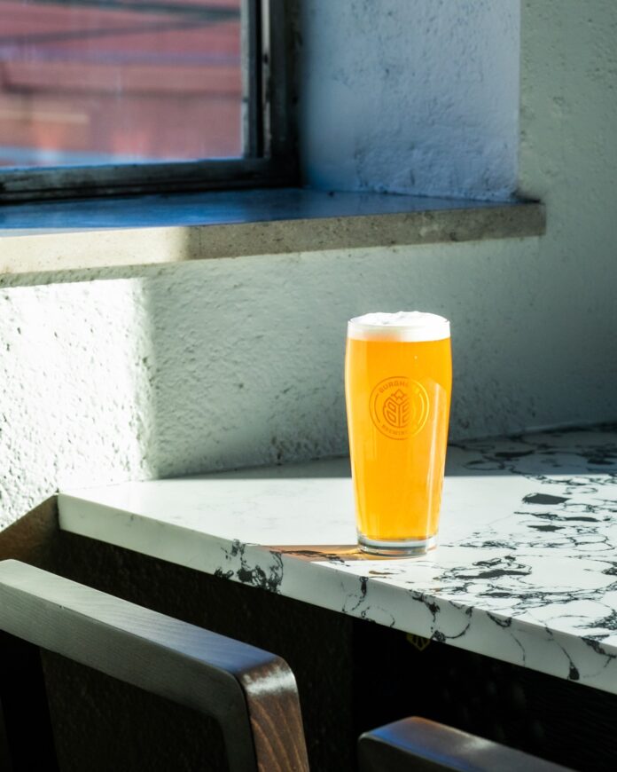 A craft beery sits on the marble table of a Pittsburgh brewery.