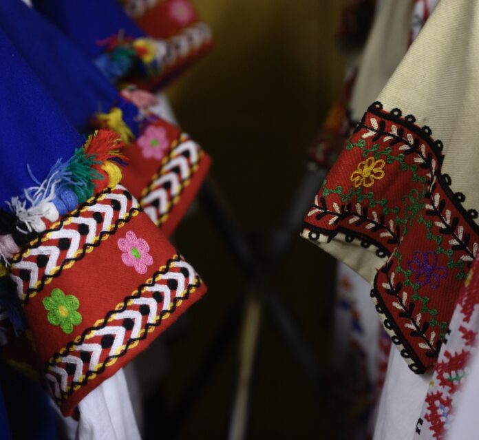 Pieces of traditional Bulgarian clothing showcase the embroidered sleeves.