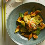 a blue bowl filled with Deconstructed Tofu Bahn Mi on top of a table.