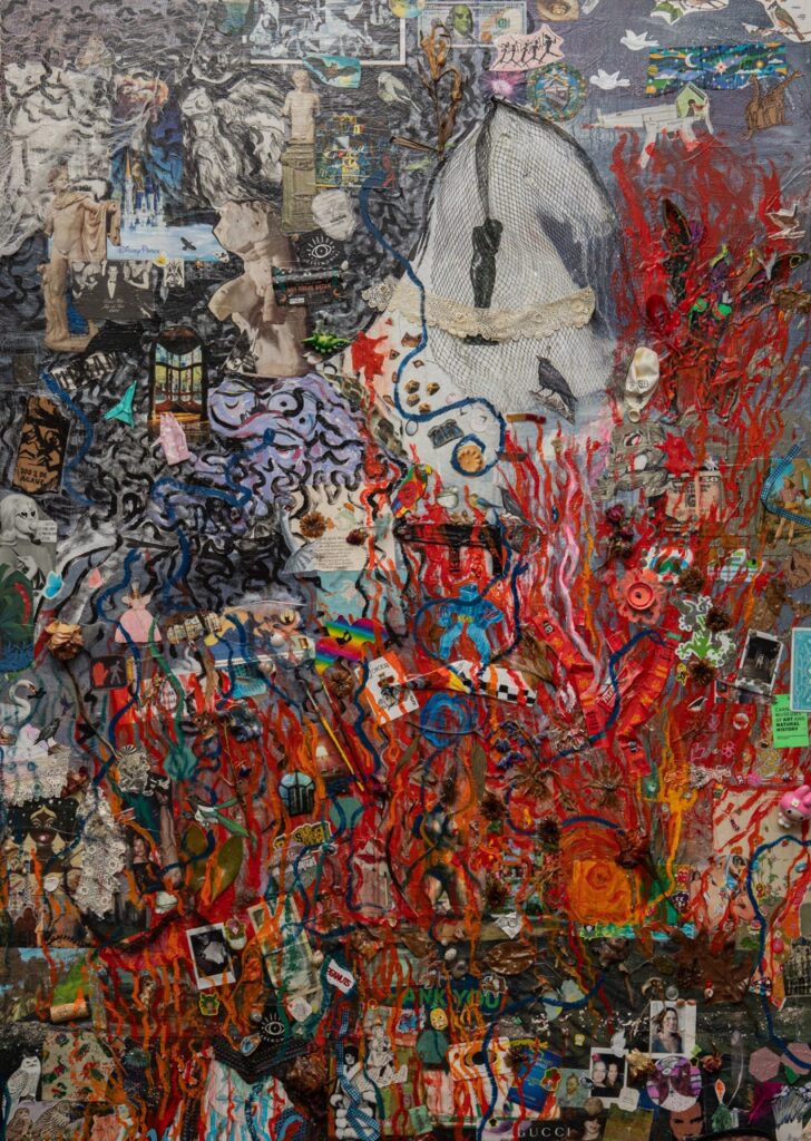 A canvas piece of art with splattered reds and other colors.