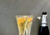 Greyhound 75 A Greyhound 75, two small glasses with a grapefruit and a Prosecco bottle beside it.