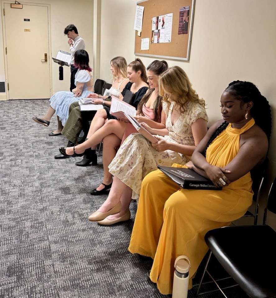 A group of women wait outside a door to audition for a Pittsburgh play.