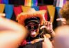 Pittsburgh Events: Your Guide to May 26-June 1 A woman in pride gear and an orange cowboy hat dances with sunglasses on.