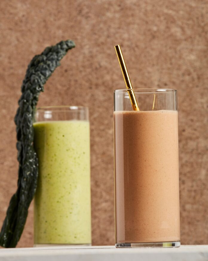 Pittsburgh Pirates' Nourishing Smoothies Pittsburgh Pirates smoothie, one brown with a gold straw sits beside a green smoothie both against a brown background.