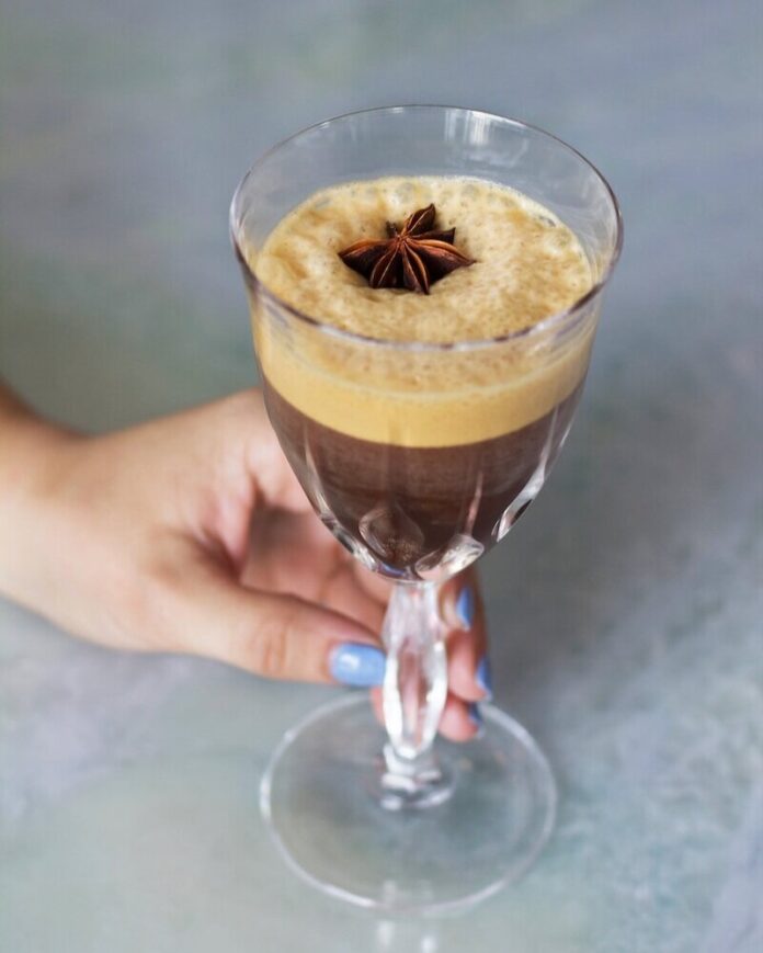 Shakerato Iced Caffé Coretto An iced caffè coretto with a garnish of anise.