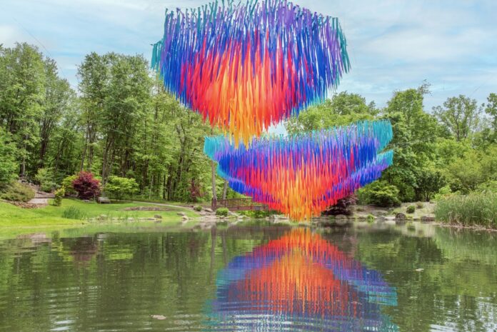 An outdoor art installation by Patrick Shearn on top of a pond in the Pittsburgh Botanic Garden.